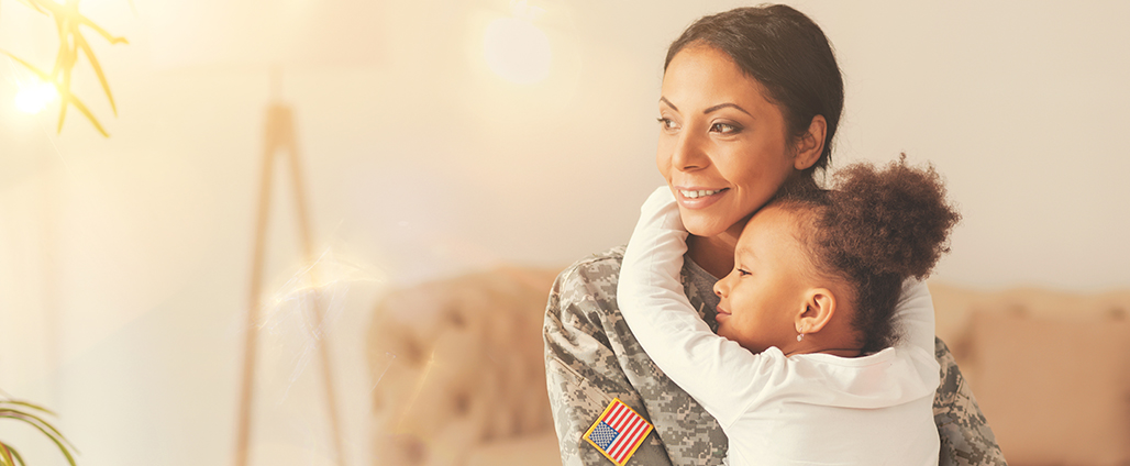 Affectionate military reunion between father and daughter Affectionate military reunion between father and daughter. Emotional military dad embracing his daughter on his homecoming. Army soldier receiving a warm welcome from his child after deployment.